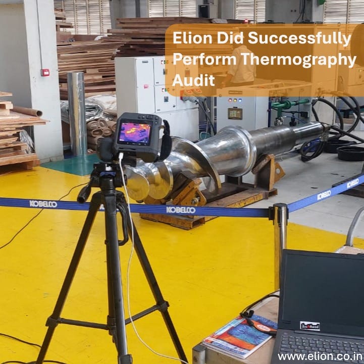 A tripod-mounted thermal camera conducts a thermography audit of large metal equipment in a workshop. A laptop and tools are nearby. Text reads, Elion Did Successfully Perform Thermography Audit. Website: www.elion.co.in.
